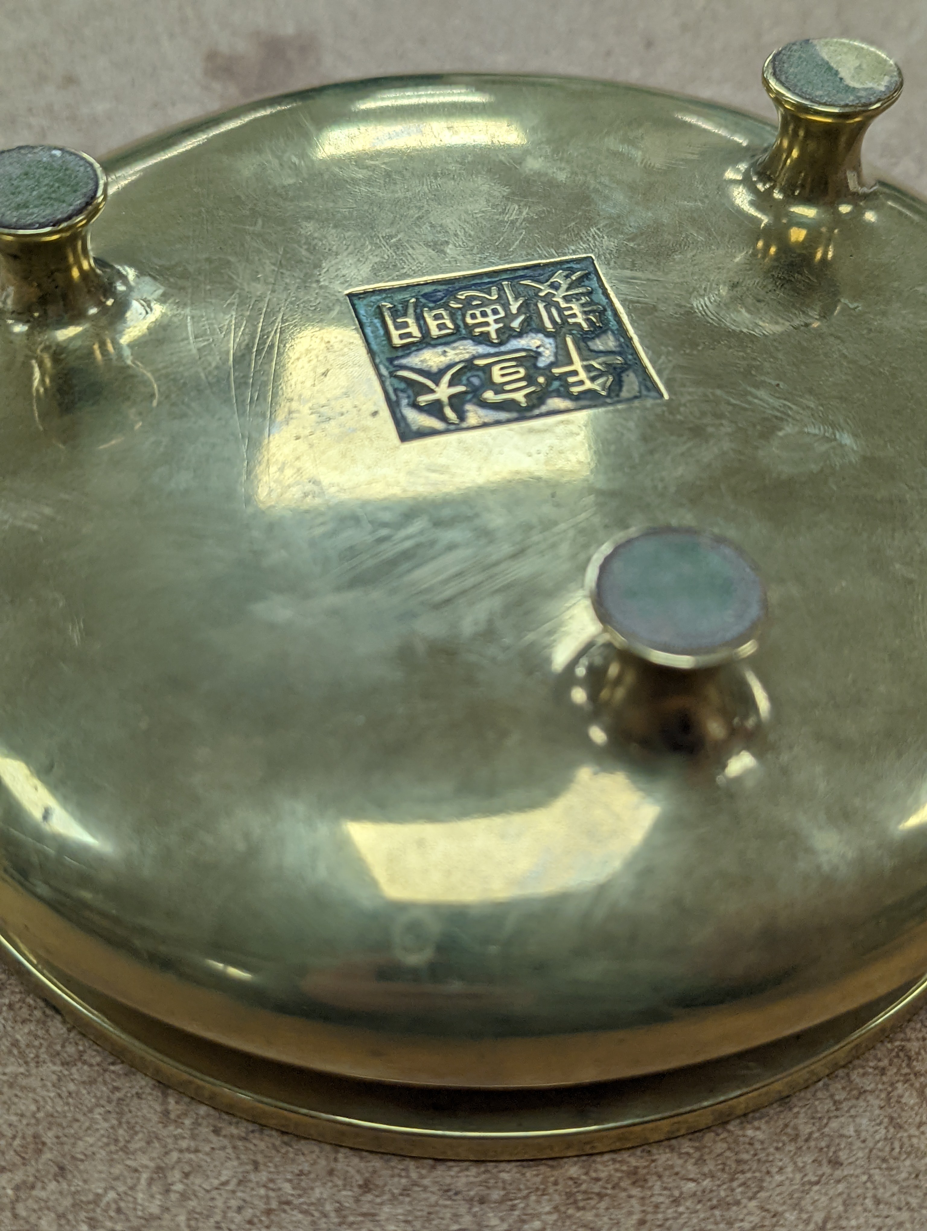 A Chinese bronze censer, ding, Xuande mark, 18th / 19th century, diameter 16.6cm, height 6.7cm